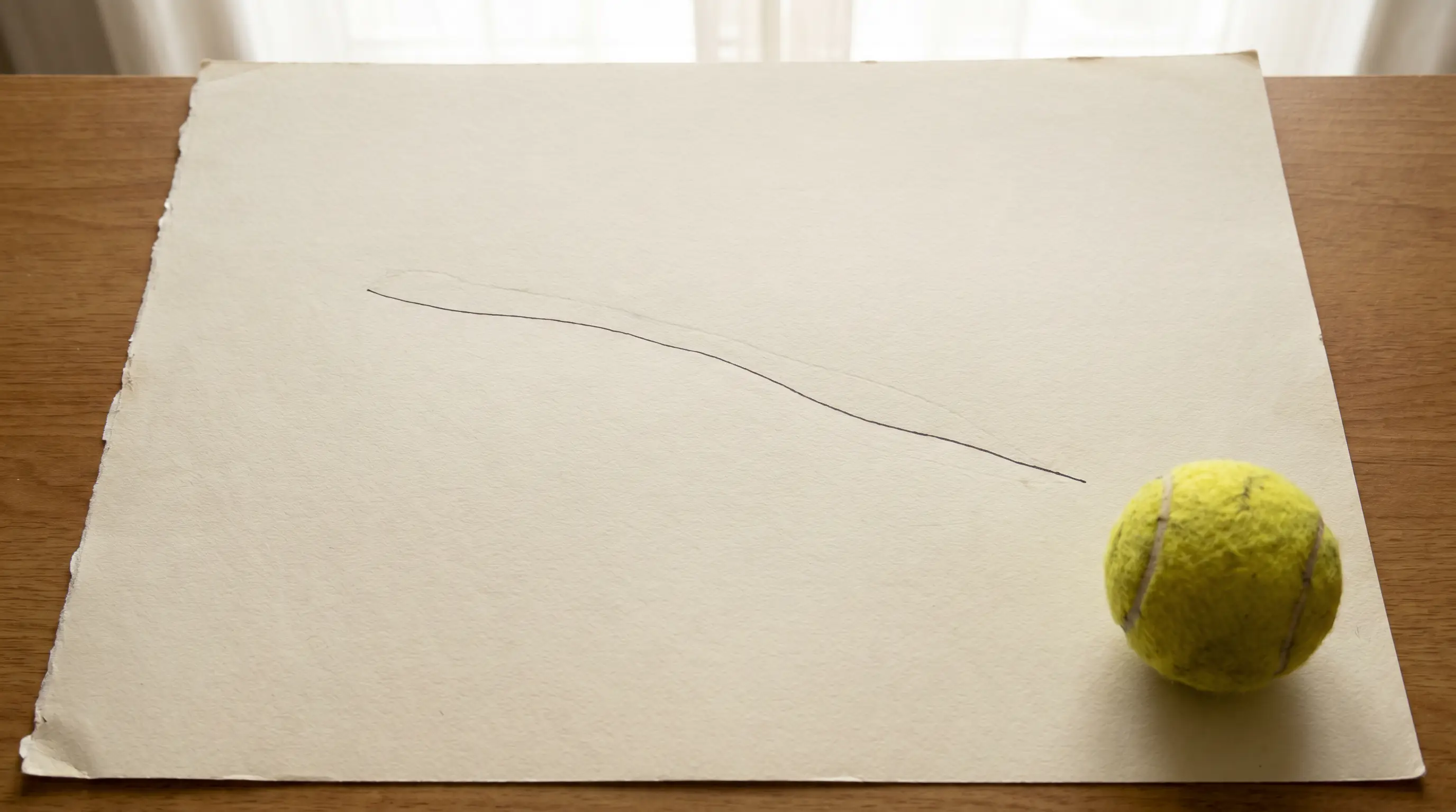 Downward trend line on paper showing tennis integrity alerts declining over time