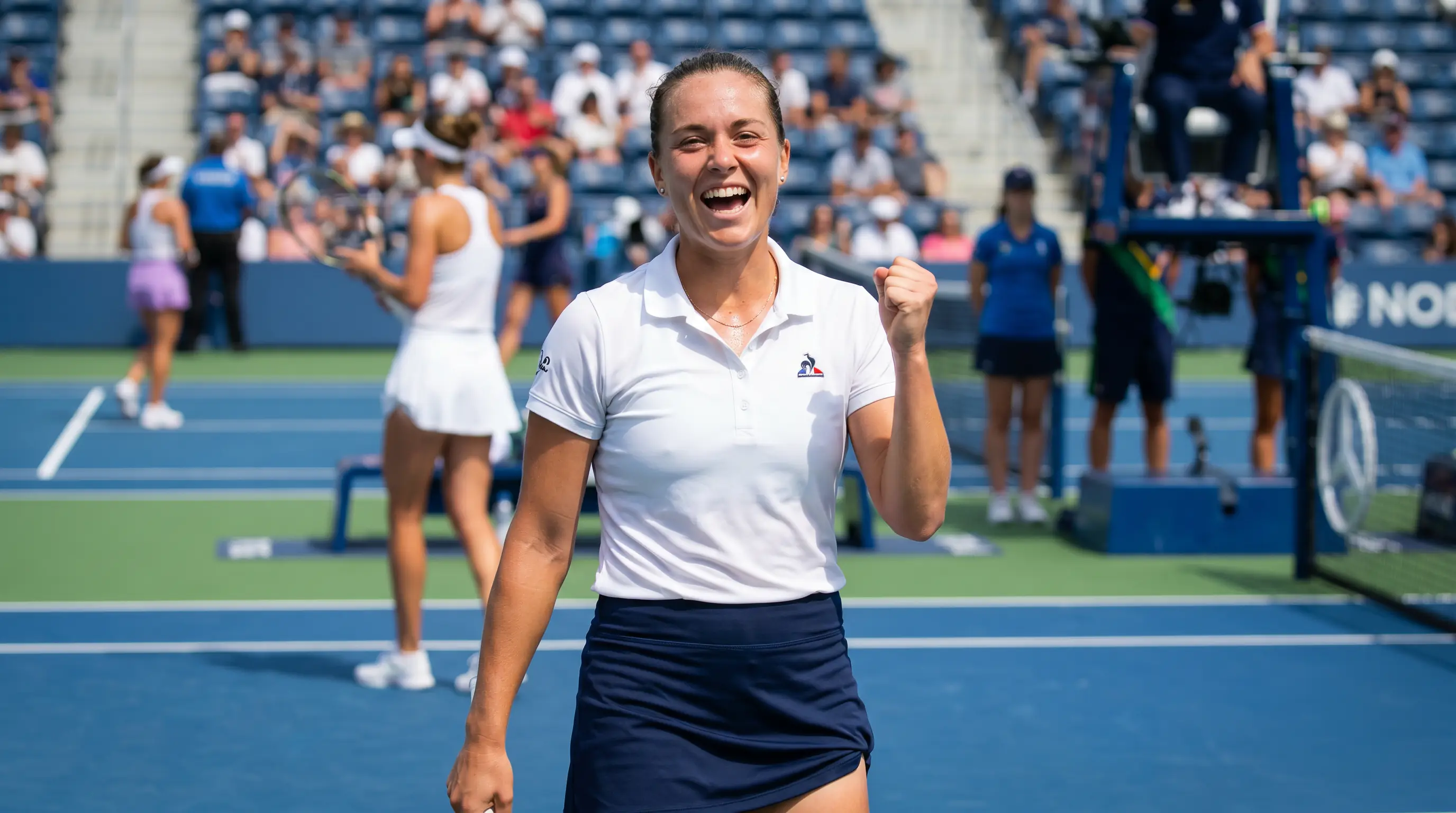A WTA underdog celebrating a won set, illustrating the more upset-prone reputation of the tour